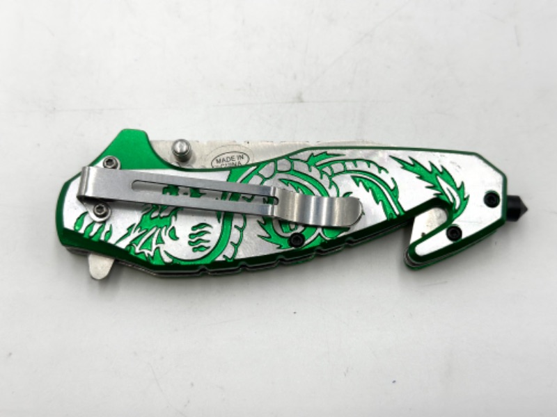 Photo 3 of GREEN DETAILED POCKET KNIFE WITH WINDOW BREAKER AND SEAT BELT CUTTER NEW