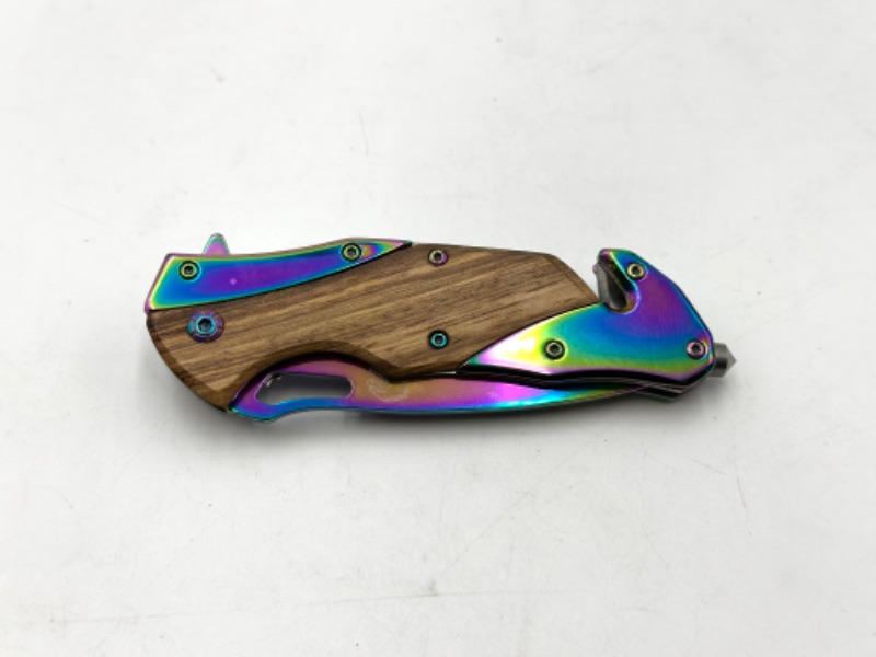 Photo 2 of WOODEN AND OIL SLICK POCKEY KNIFE WITH WINDOW BREAKER SEATBELT CUTTER AND KEYCHAIN LOOP NEW