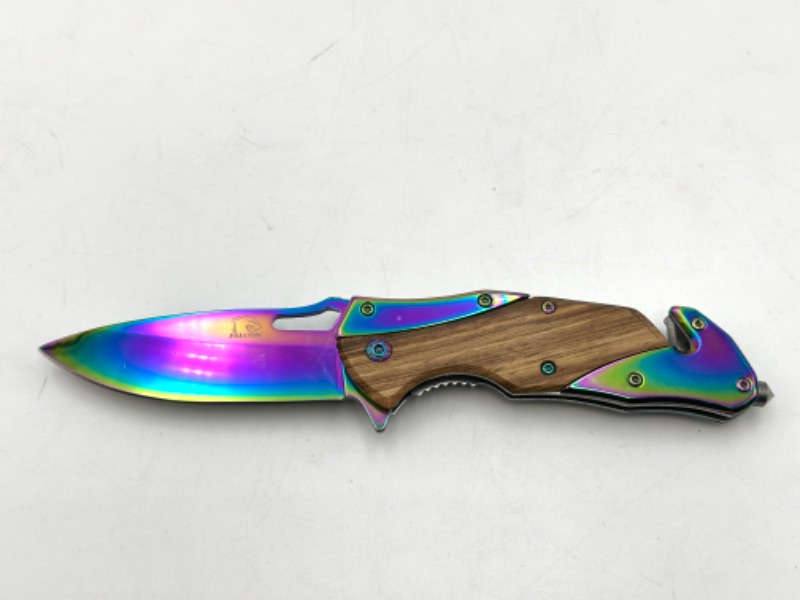 Photo 1 of WOODEN AND OIL SLICK POCKEY KNIFE WITH WINDOW BREAKER SEATBELT CUTTER AND KEYCHAIN LOOP NEW