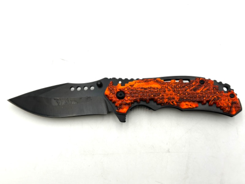 Photo 1 of ORANGE AND BLACK DESIGNED POCKET KNIFE NEW