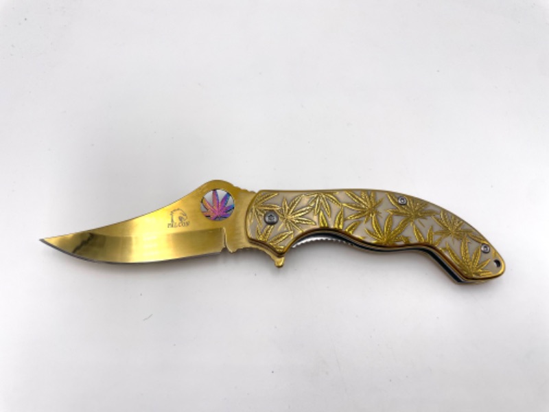 Photo 1 of GOLD WITH HEMP LEAF 
AND RAINBOW SINGLE HEMP LEAF POCKET KNIFE WITH CLIP NEW 