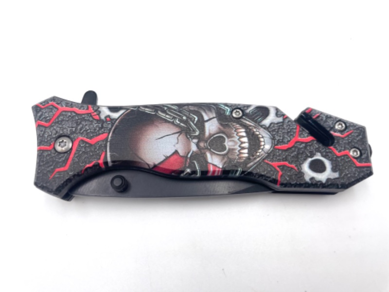 Photo 2 of SKULL WITH RED AND BLACK MECHANICAL BACKGROUND DETAIL POCKET KNIFE WITH SEATBELT CUTTER NEW 