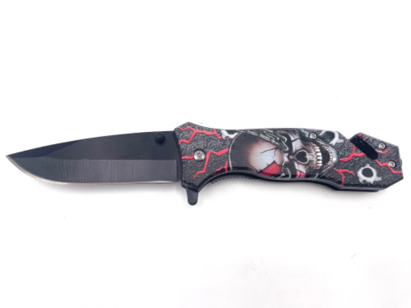 Photo 1 of SKULL WITH RED AND BLACK MECHANICAL BACKGROUND DETAIL POCKET KNIFE WITH SEATBELT CUTTER NEW 