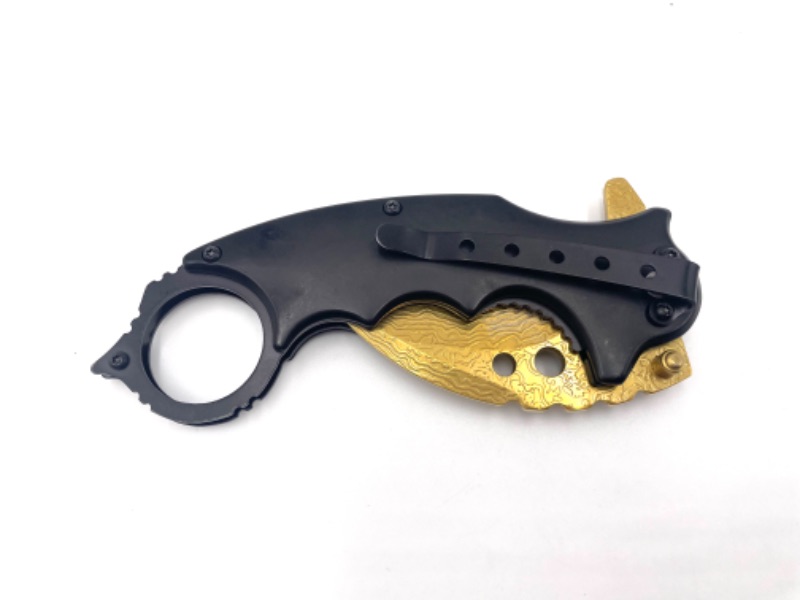 Photo 3 of BLACK CLAW POCKET KNIFE WITH GOLD BLADE AND DESIGN NEW 