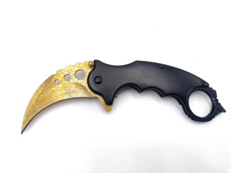 Photo 1 of BLACK CLAW POCKET KNIFE WITH GOLD BLADE AND DESIGN NEW 