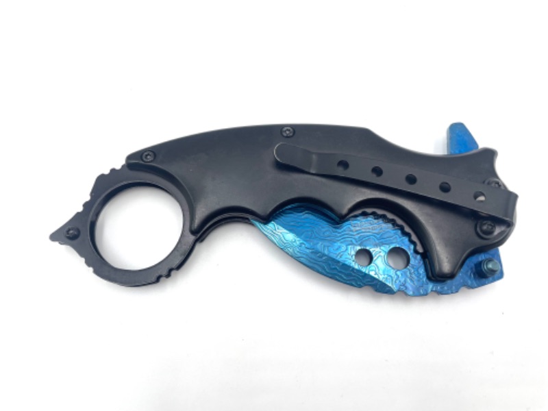 Photo 3 of BLACK HANDLE WITH BLUE CLAW AND DESIGN ON BLADE POCKET KNIFE WITH CLIP NEW 