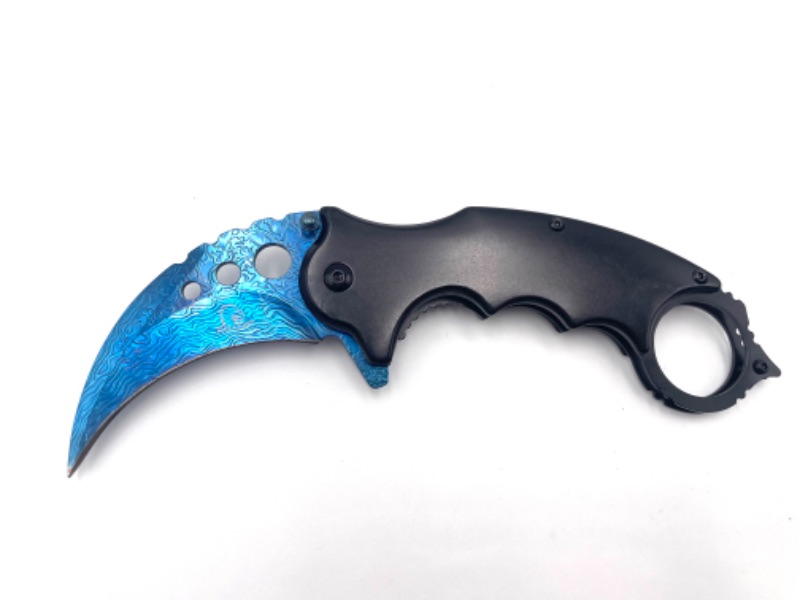 Photo 1 of BLACK HANDLE WITH BLUE CLAW AND DESIGN ON BLADE POCKET KNIFE WITH CLIP NEW 