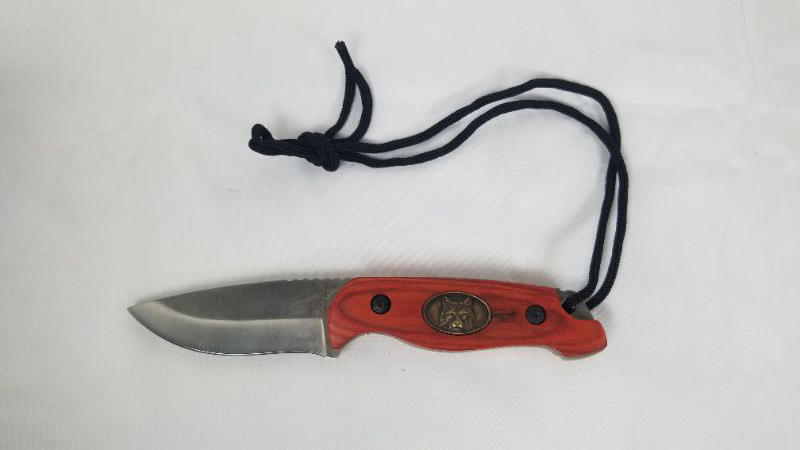 Photo 1 of WOLF MEDALLION 7.5 INCH KNIFE WITH CARRY STRAP NEW