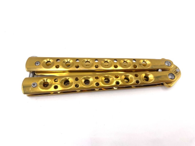 Photo 2 of GOLD BUTTERFLY PRACTICE KNIFE
WITH SWIGGLY BLADE NEW 