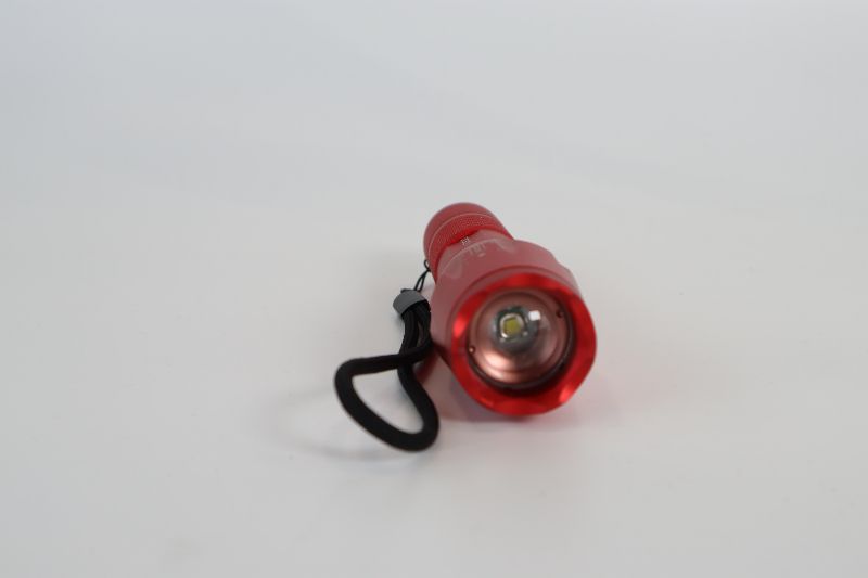 Photo 1 of RED TACTICAL FLASHLIGHT WITH ZOOM FEATURE NEW 