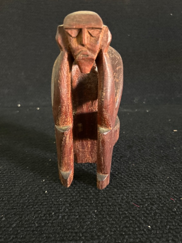 Photo 1 of Vintage Carved wooden statue of man holding ears appx 7 inches tall 