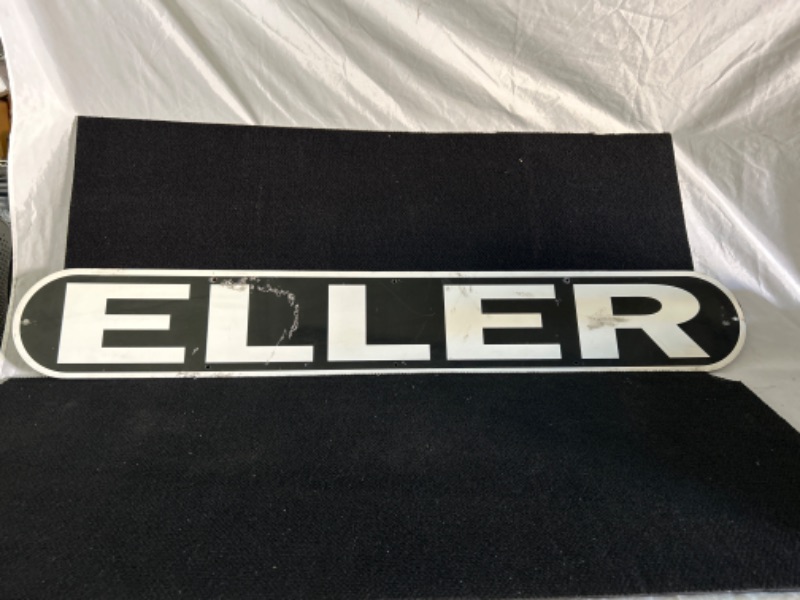 Photo 1 of metal advertising sign says ELLER  appx 48 x 7 inches 