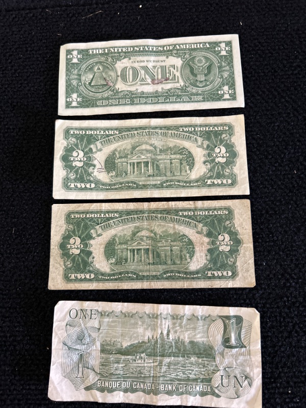 Photo 2 of Vintage money includes 1957A silver certificate 1963 and 1928 $2 bills and 1973 Canadian dollar 