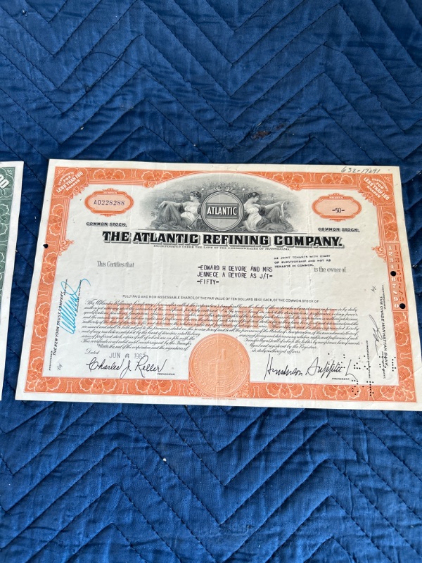 Photo 2 of two Atlantic refining company stock certificates $100 and $50 1984 and 1962