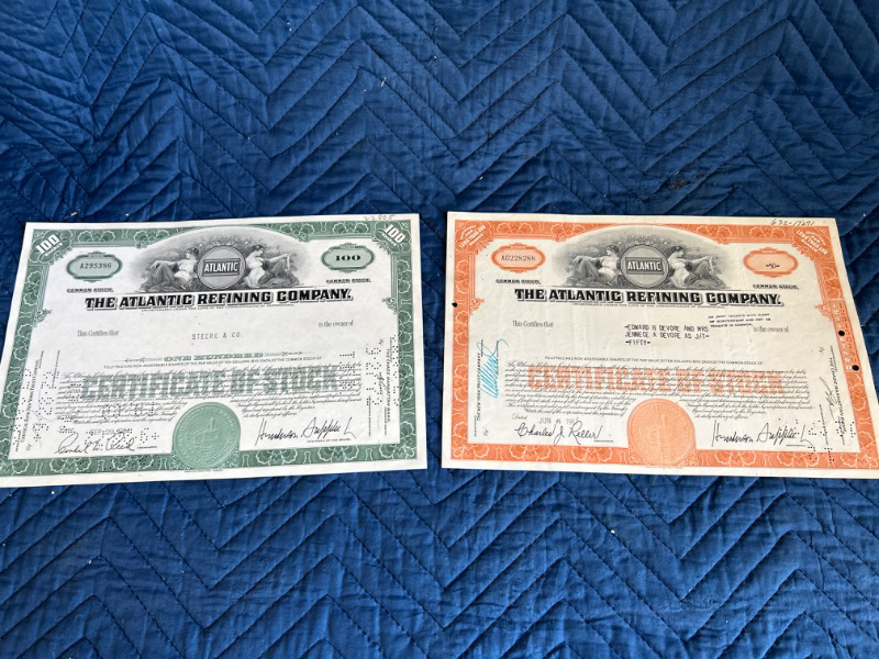 Photo 1 of two Atlantic refining company stock certificates $100 and $50 1984 and 1962