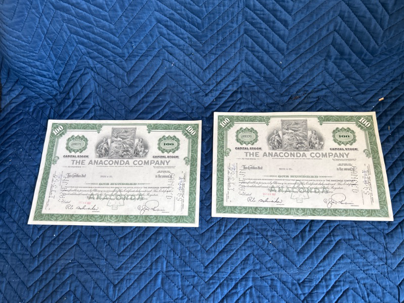 Photo 1 of two $100 1967 Anaconda  company stock certificates