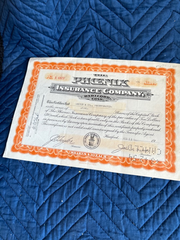 Photo 2 of two  stock certificates central Farmers trust 1925 and Phoenix Insurance 1954 