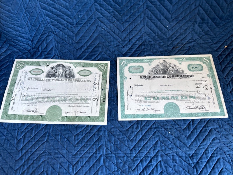 Photo 1 of two Studebaker stock certificates 1955 and 1963 