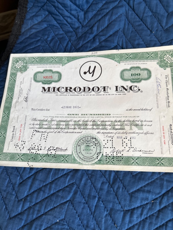 Photo 2 of two Vintage MicroDot Inc. 1960 and 1961 stock certificates