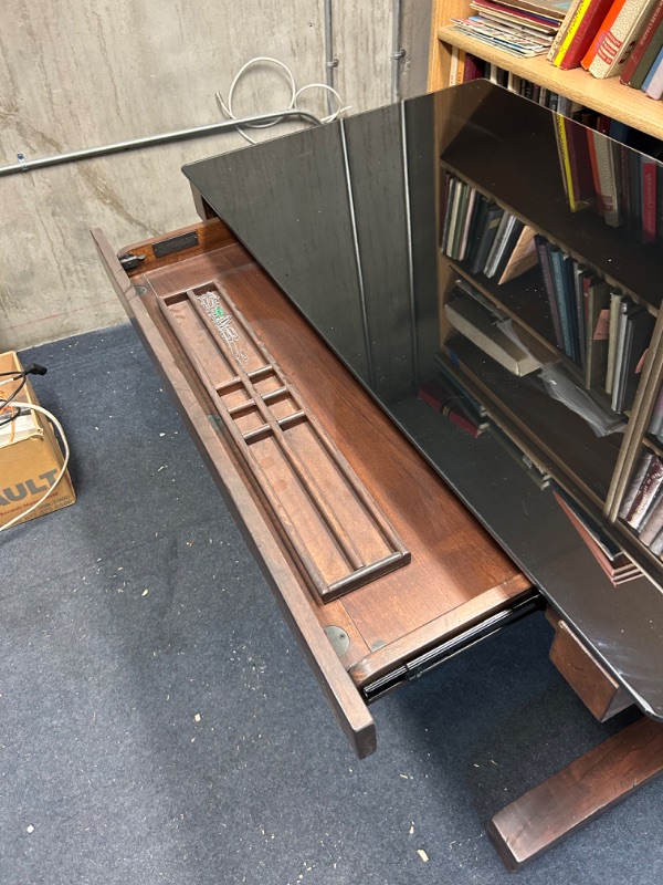 Photo 2 of Unique wooden desk with black glass top by Whalen 48 x 28 x 30 inches tall has a few scratches 