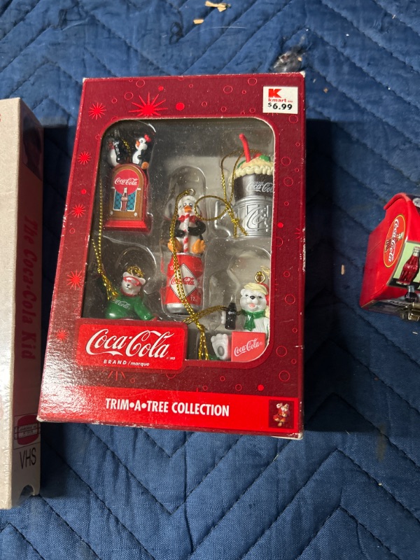 Photo 2 of Coca Cola items including mini ornaments, Lunchbox and Coca Cola Kid VHS sealed 