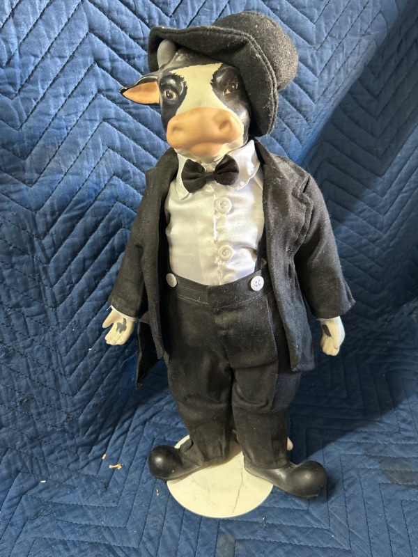 Photo 1 of Glass and cloth cow in suit on stand measures 17" tall 