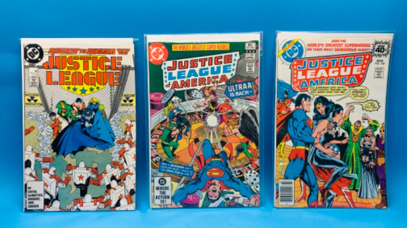 Photo 1 of 462467…vintage justice league comics in plastic sleeves 