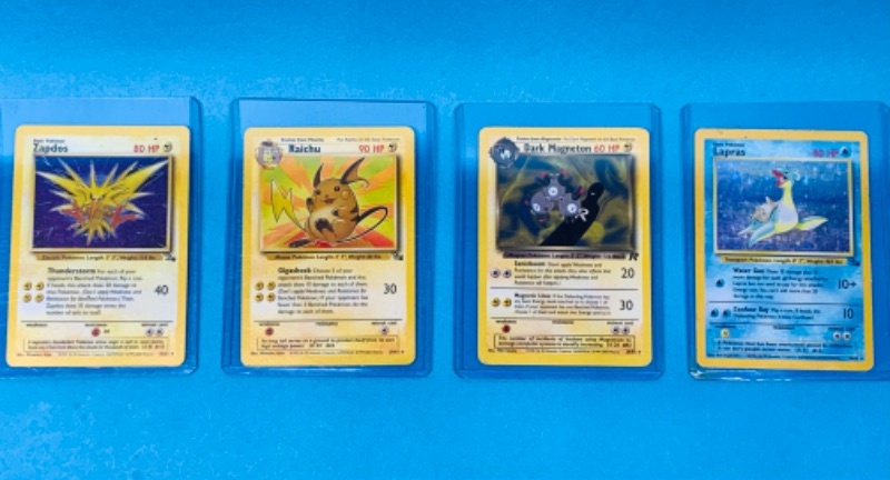 Photo 1 of 462490…4 Pokémon cards in hard sleeves 2 holo cards -corners show wear-year 1999-2000