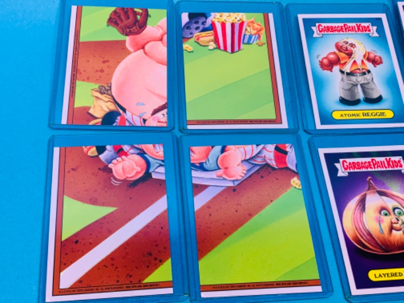 Photo 2 of 462494…8 garbage pail kids cards in hard sleeves with puzzle on back sides