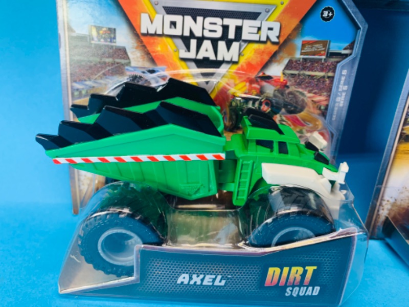 Photo 2 of 494664… 3 monster jam dirt squad toy trucks in packages 