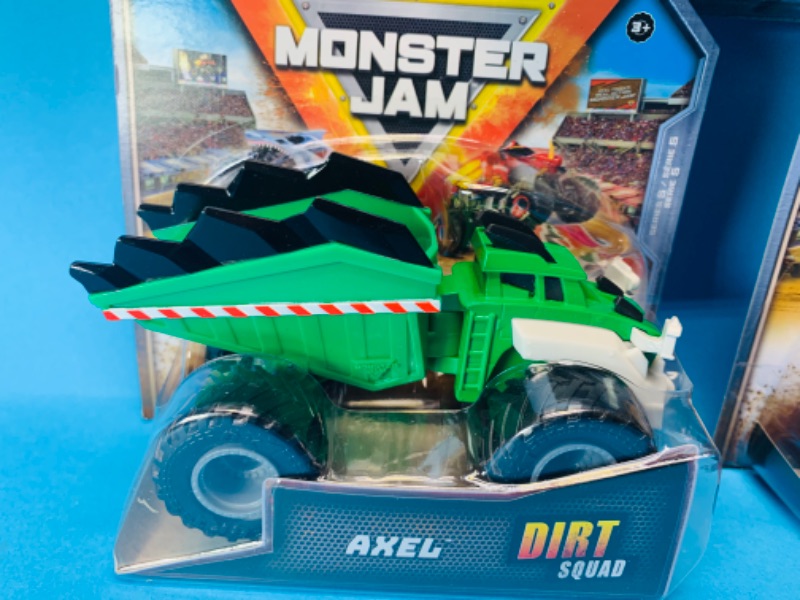 Photo 2 of 494664… 3 monster jam dirt squad trucks in packages 