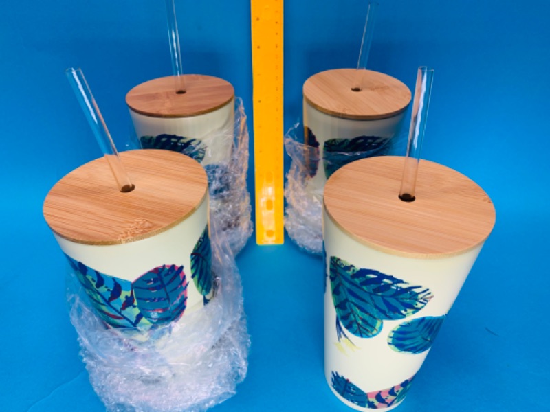 Photo 1 of 494801… 4 stainless steel tumblers with bamboo lids and straws 