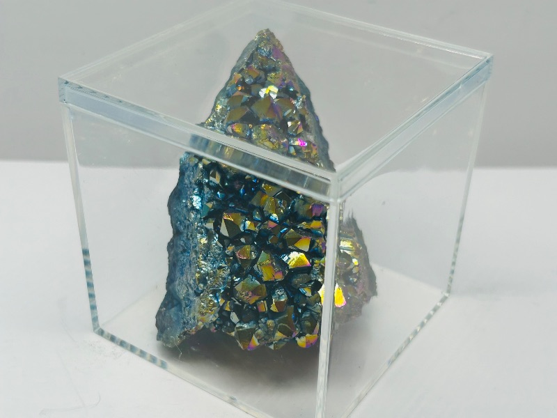 Photo 1 of 494969…rainbow electroplated titanium rock in 3 x 3” acrylic case