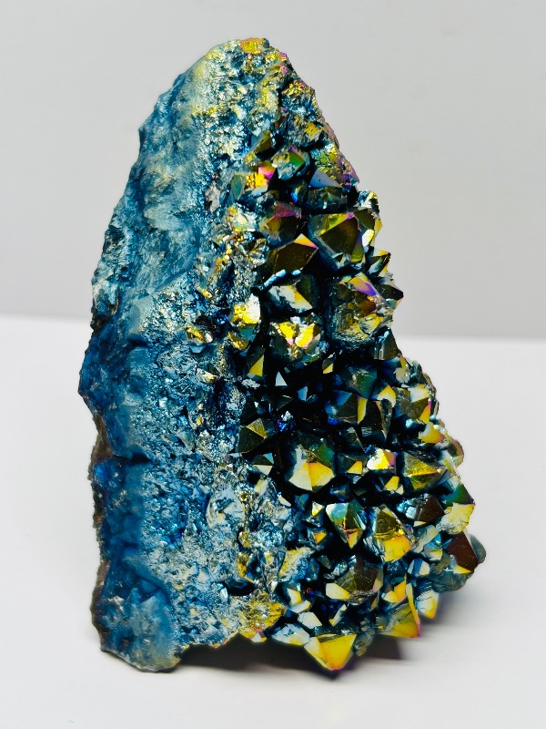 Photo 1 of 494969…rainbow electroplated titanium rock in 3 x 3” acrylic case