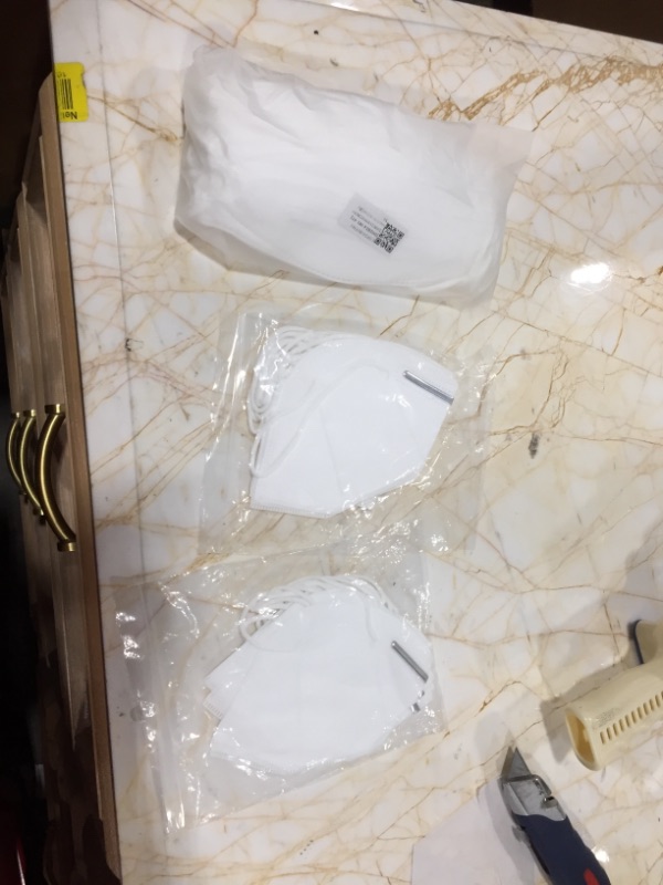 Photo 1 of Multi Disposable White Masks 