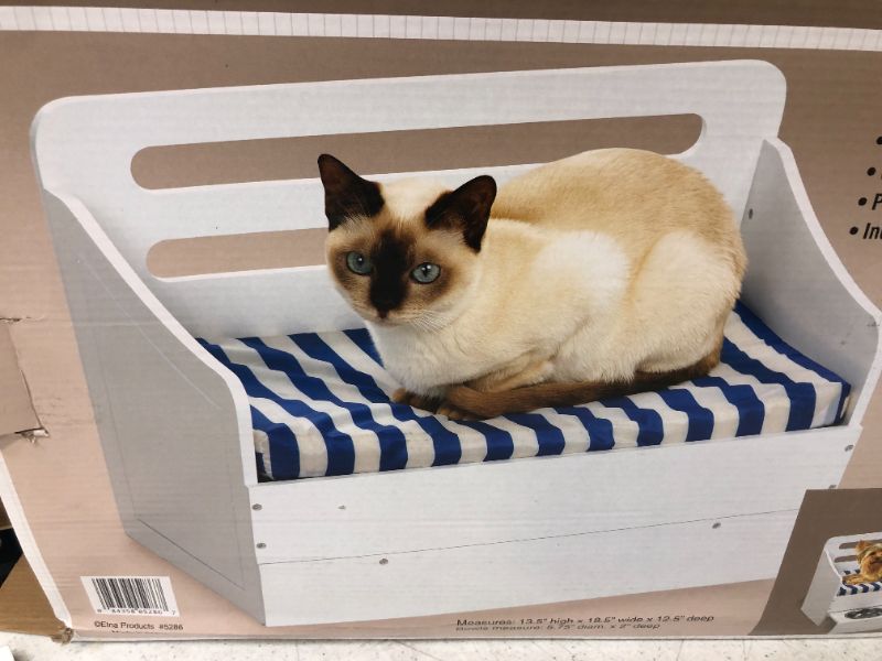 Photo 1 of ELEVATED SMALL PET SOFA BED WITH PULLOUT FEEDER COMFY AND EASY TO CLEAN METAL BASINS INCLUDED COLOR WHITE NEW IN BOX $65