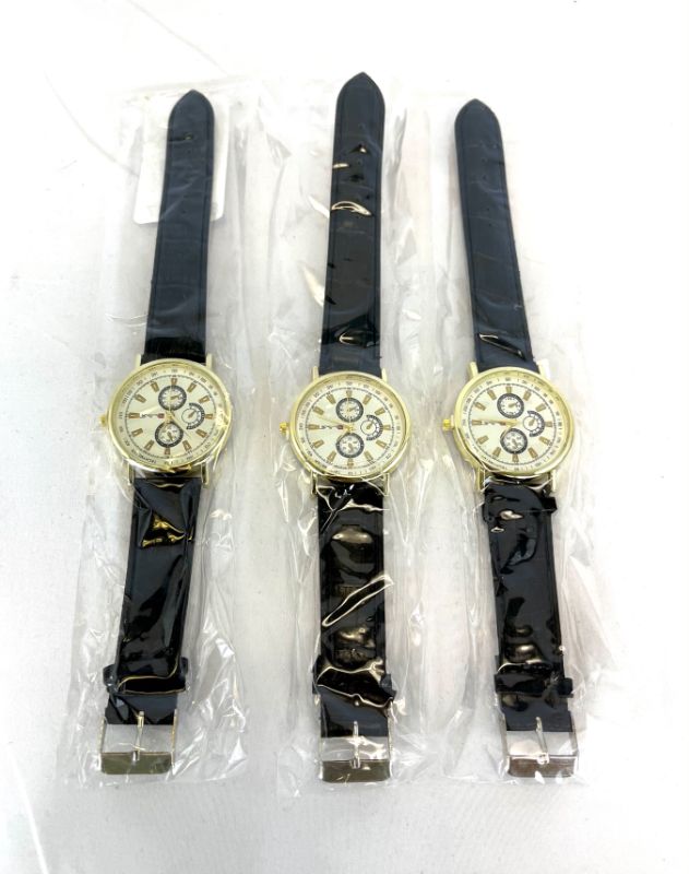 Photo 1 of PACK OF 3 BLACK THIN FASHION WATCHES WITH FAUX GOLD ACCENTS NEW $19.99