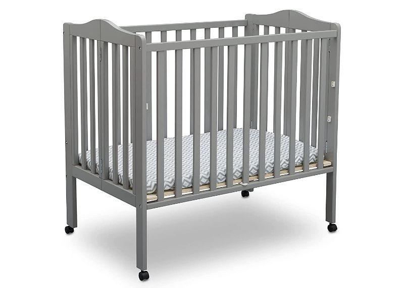 Photo 1 of Delta Children Folding Portable Mini Crib with 1.5-inch Mattress, Gray
