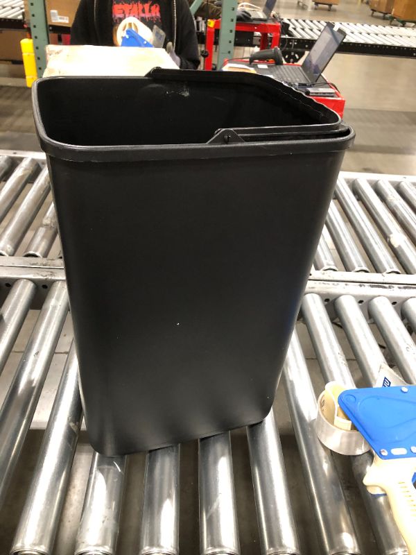 Photo 1 of 17"H x 10"W x 12"L trash bin with handle 