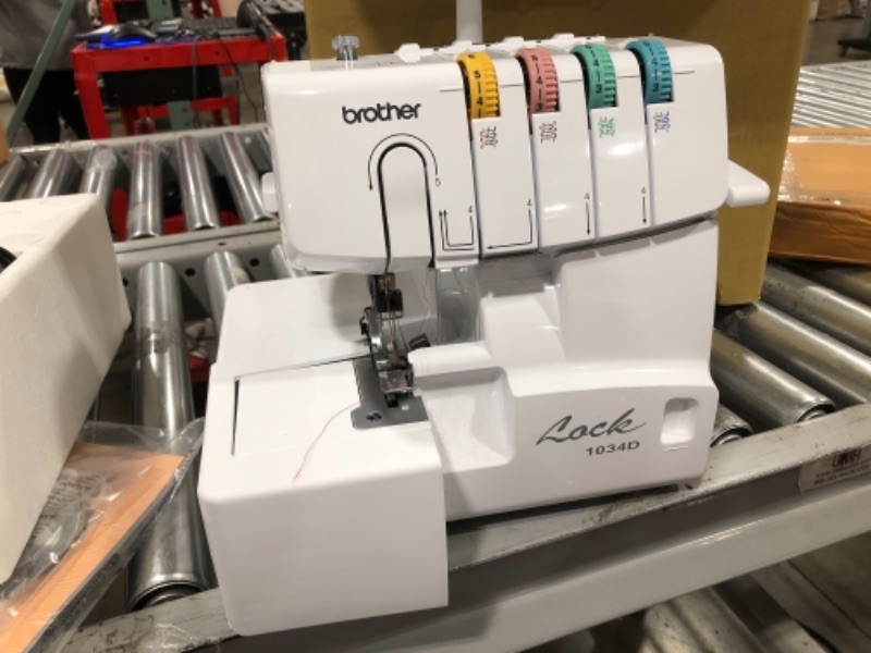 Photo 3 of Brother Serger, 1034D, Heavy-Duty Metal Frame Overlock Machine, 1,300 Stitches Per Minute, Removeable Trim Trap, 3 Included Accessory Feet,White
