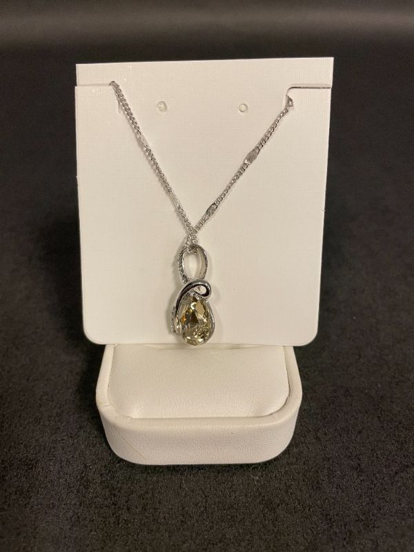 Photo 1 of SWAROVSKI 18K WHITE GOLD PLATED NECKLACE WITH TOPAZ COLOR CRYSTAL