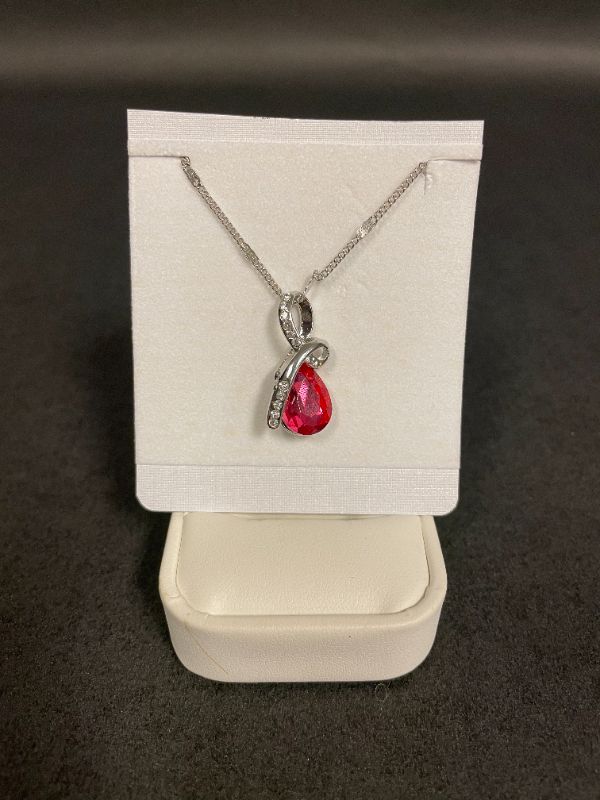 Photo 1 of SWAROVSKI 18K WHITE GOLD PLATED NECKLACE WITH RUBY RED CRYSTAL 