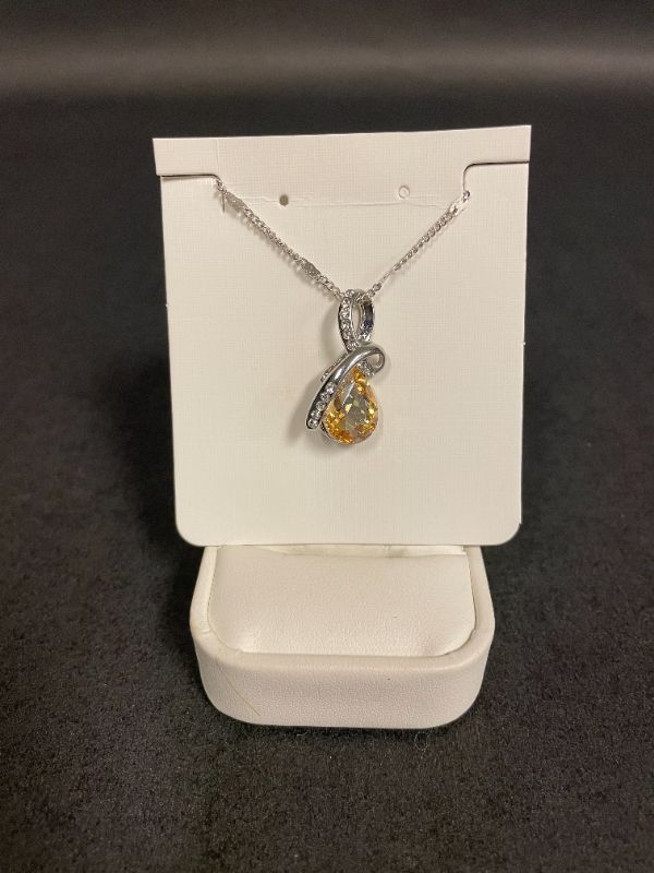 Photo 1 of SWAROVSKI 18K WHITE GOLD PLATED NECKLACE WITH YELLOW TOPAZ CRYSTAL