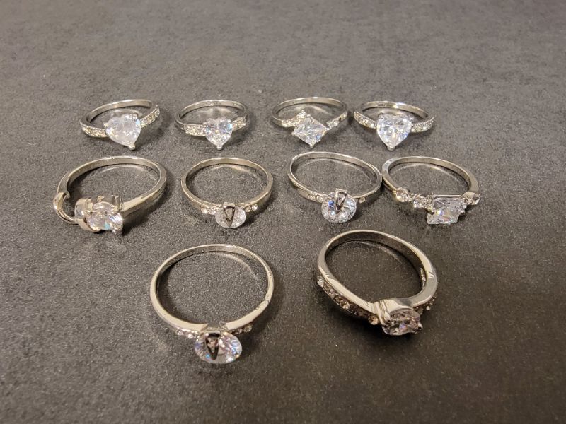 Photo 1 of BAG OF 10 SILVER COLORED CZ RINGS IN VARIOUS SIZES