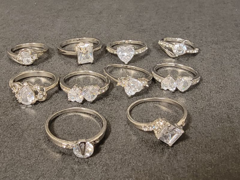 Photo 1 of BAG OF 10 SILVER COLORED CZ RINGS IN VARIOUS SIZES