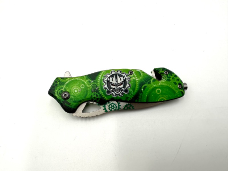 Photo 2 of GREEN CLOCKS AND SKULL DESIGN POCKET KNIFE NEW