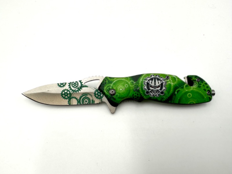 Photo 1 of GREEN CLOCKS AND SKULL DESIGN POCKET KNIFE NEW