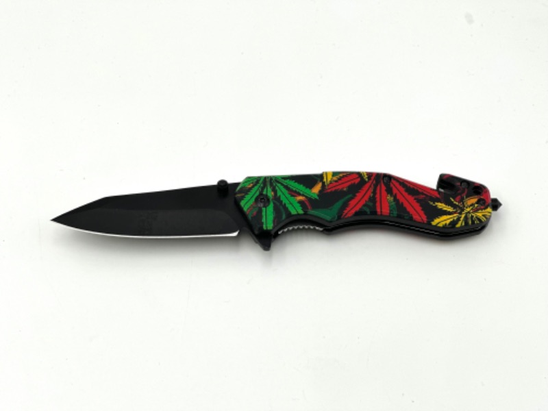 Photo 1 of COLORFUL HEMP LEAF DESIGN POCKET KNIFE WITH WINDOW BREAKER AND SEAT BELT CUTTER NEW 