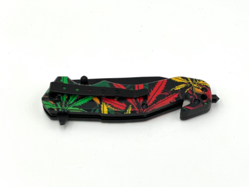 Photo 2 of COLORFUL HEMP LEAF DESIGN POCKET KNIFE WITH WINDOW BREAKER AND SEAT BELT CUTTER NEW 