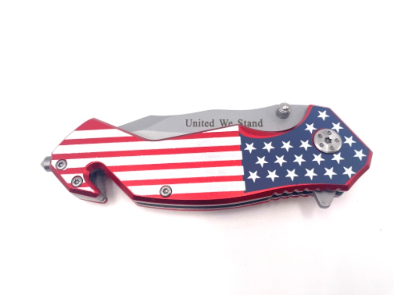Photo 1 of UNITED WE STAND AMERICAN FLAG WITH CLIP POCKET KNIFE WITH SEAT BELT CUTTER NEW 